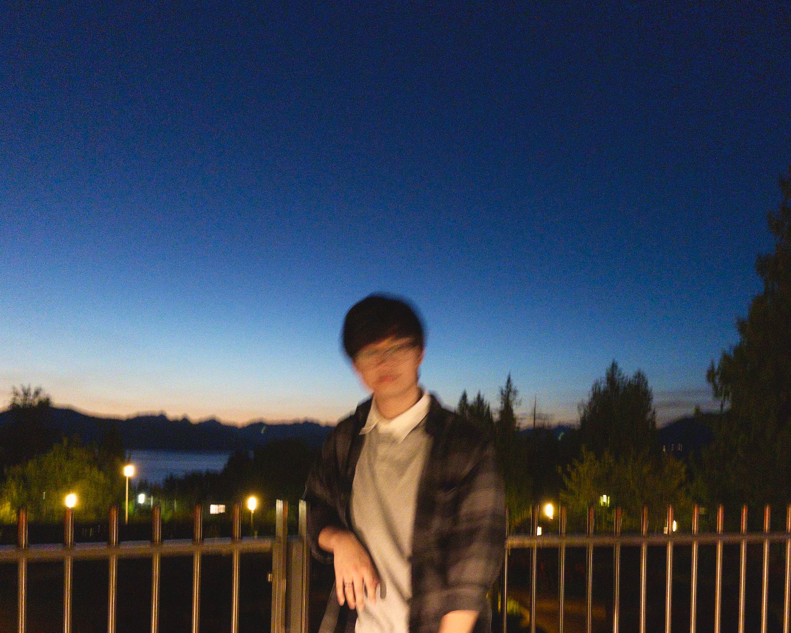 Picture of Dio Dziban standing in front of a sunset.